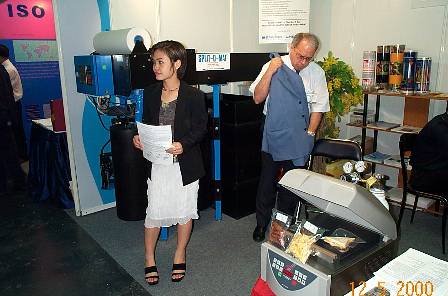 Khun Dee and Khun Beat preparing something - - in the front our K2 Vacuum Gas packaging machine with some samples