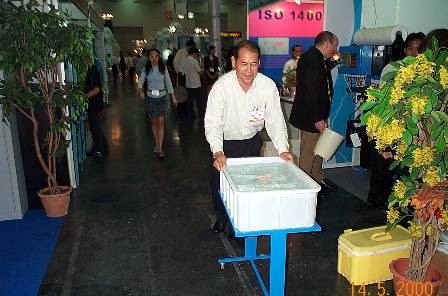 Khun Pairoj transferring treated water to a place called "Hong-naam"